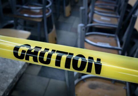 Caution tape at school for crime scene in need of cleanup in Garland